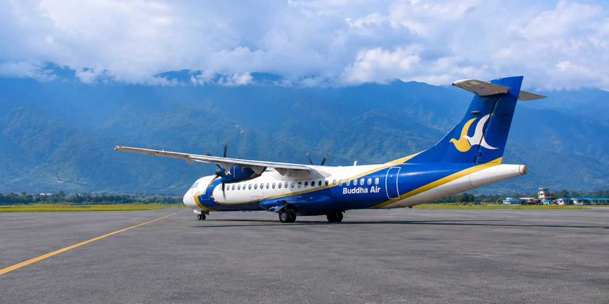 Daily flights in Nepal with Buddha Air aircraft on the runway serving domestic airline routes including Kathmandu, Lukla, Pokhara and Jomsom