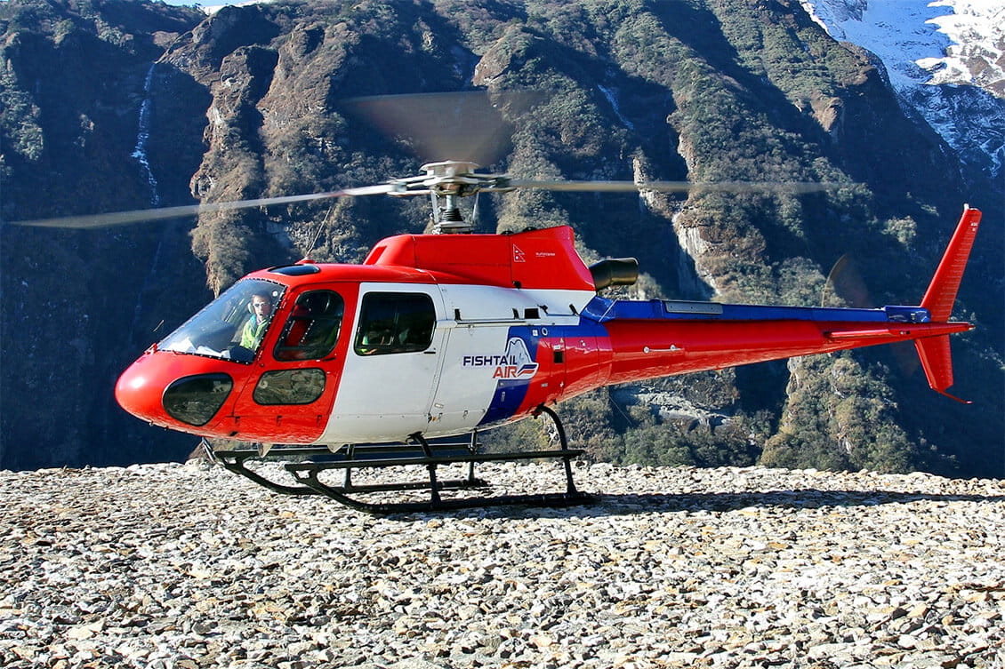 Fishtail Air helicopter operating a scenic mountain flight in Nepal