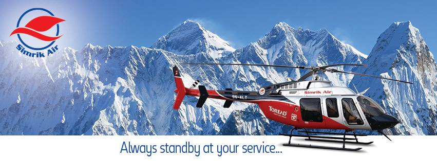 Simrik Air helicopter flying above the Himalayan mountains in Nepal